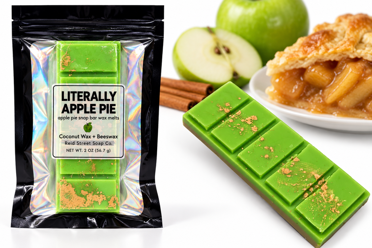 Styled concept photo of Literally Apple Pie wax melts and pouch with apples and pie