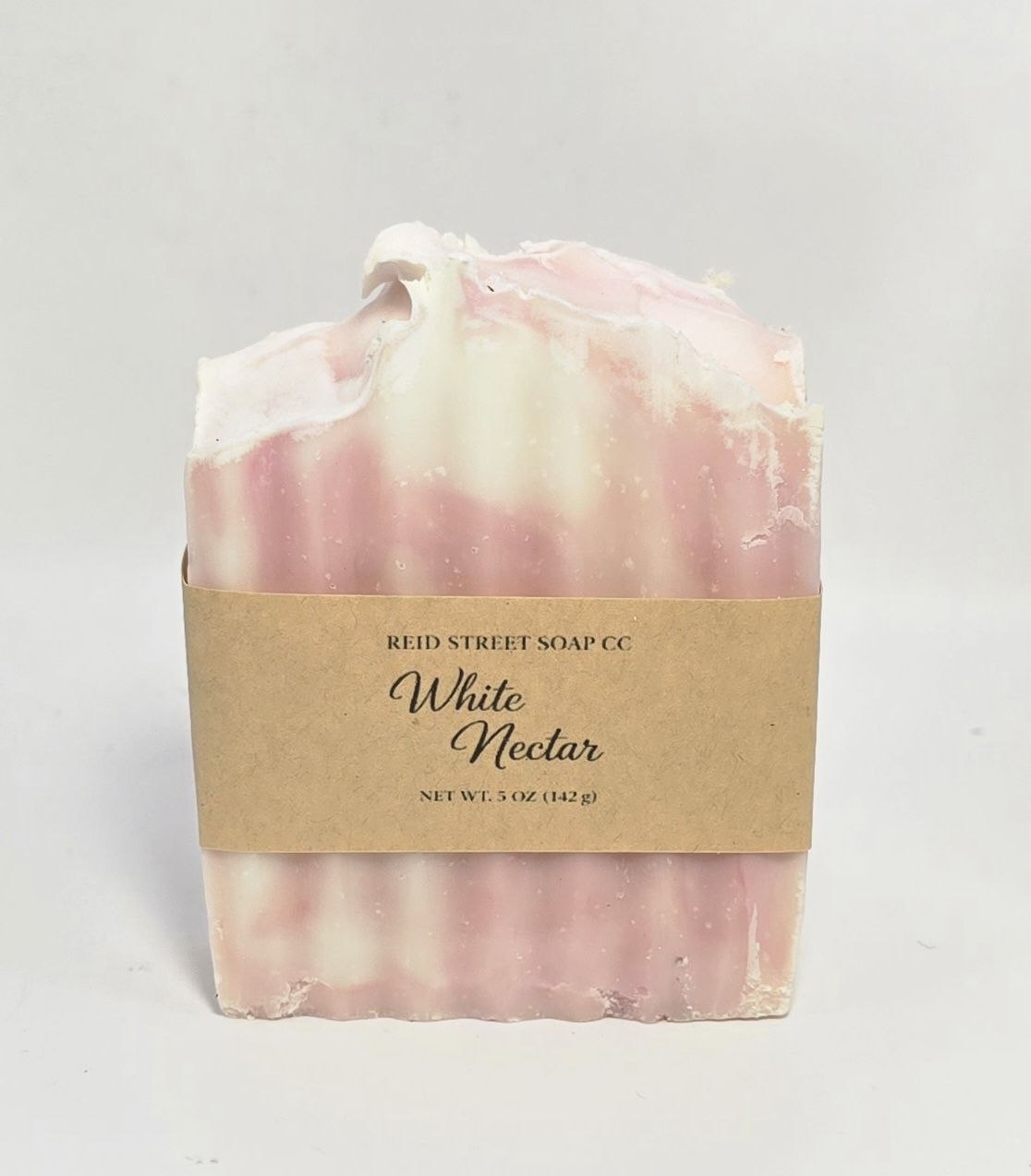 Bar of soap with a 'White Nectar' label on a gray background