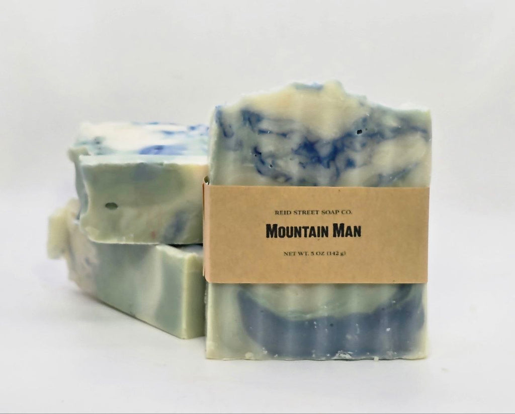 Three bars of soap with a 'Mountain Man' label on a white background